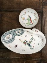 A French porcelain dish, painted with flowers, bird and insects, Chantilly mark, together with a