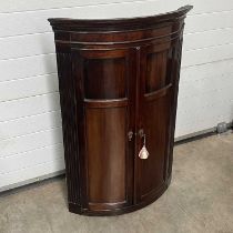 A mahogany corner cupboard, fitted three shelves W: 79 cm D: 53 cm H: 119 cm