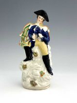 A Staffordshire portrait figure of Napoleon, circa 1840, modelled in military uniform and bicorn