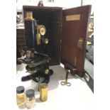 W Watson & Sons Ltd, 'Service Microscope, with additional aperture etc, in mahogany case, 38cm