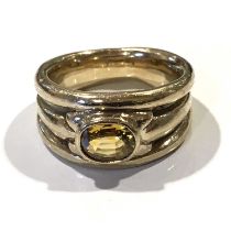 A 9ct gold citrine single-stone band ring