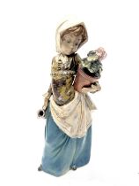 A Lladro figure of a girl holding a potted plant and a pitcher, 33cm high