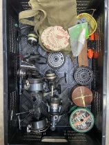 A quantity of fishing paraphernalia, reels for sea and river, brands include Daiwa, Shakespeare
