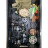 A quantity of fishing paraphernalia, reels for sea and river, brands include Daiwa, Shakespeare