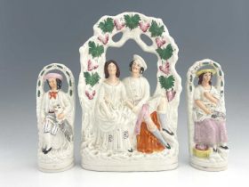 A Staffordshire arboreal figure group, circa 1870, figures glazed white with polychrome enamel and