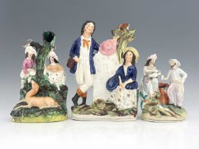 Three Staffordshire spill vases, circa 1830, including two children and a faun in a forest