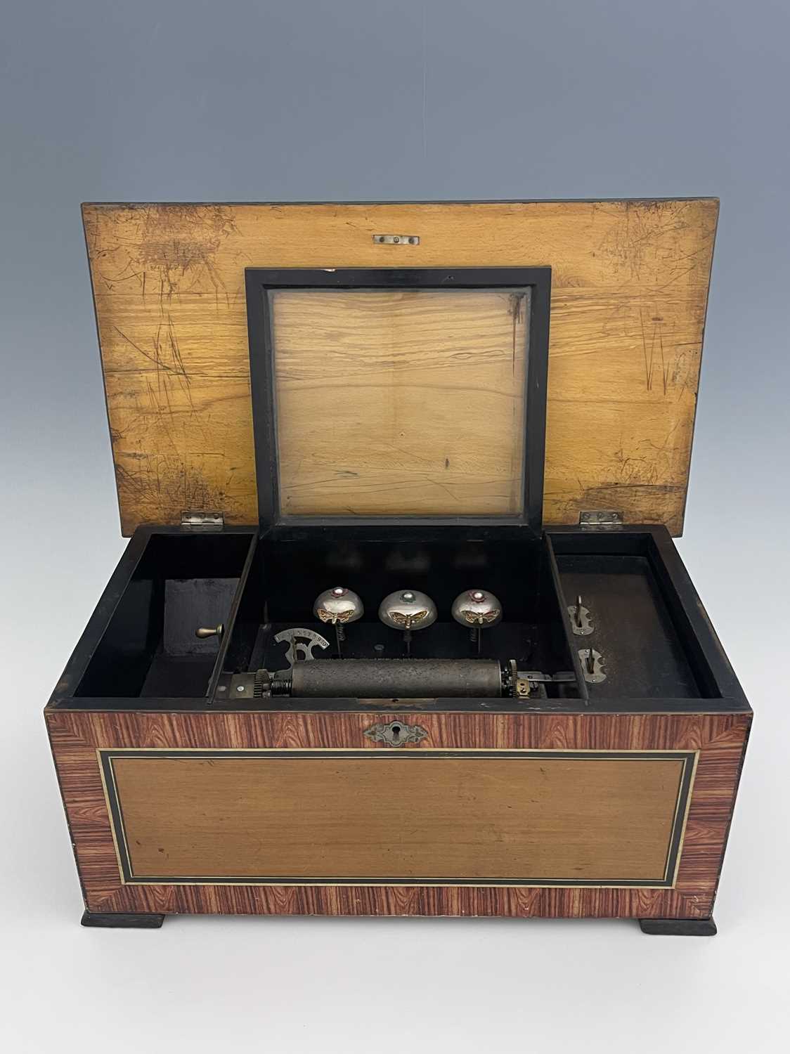 A 19th century Swiss 10 air musical box, with three bells, simulated rosewood case with painted