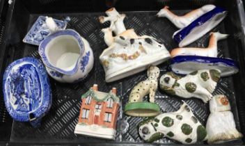 Collection of Staffordshire ceramics including a house money box, flatback spill vase, dog hunting a