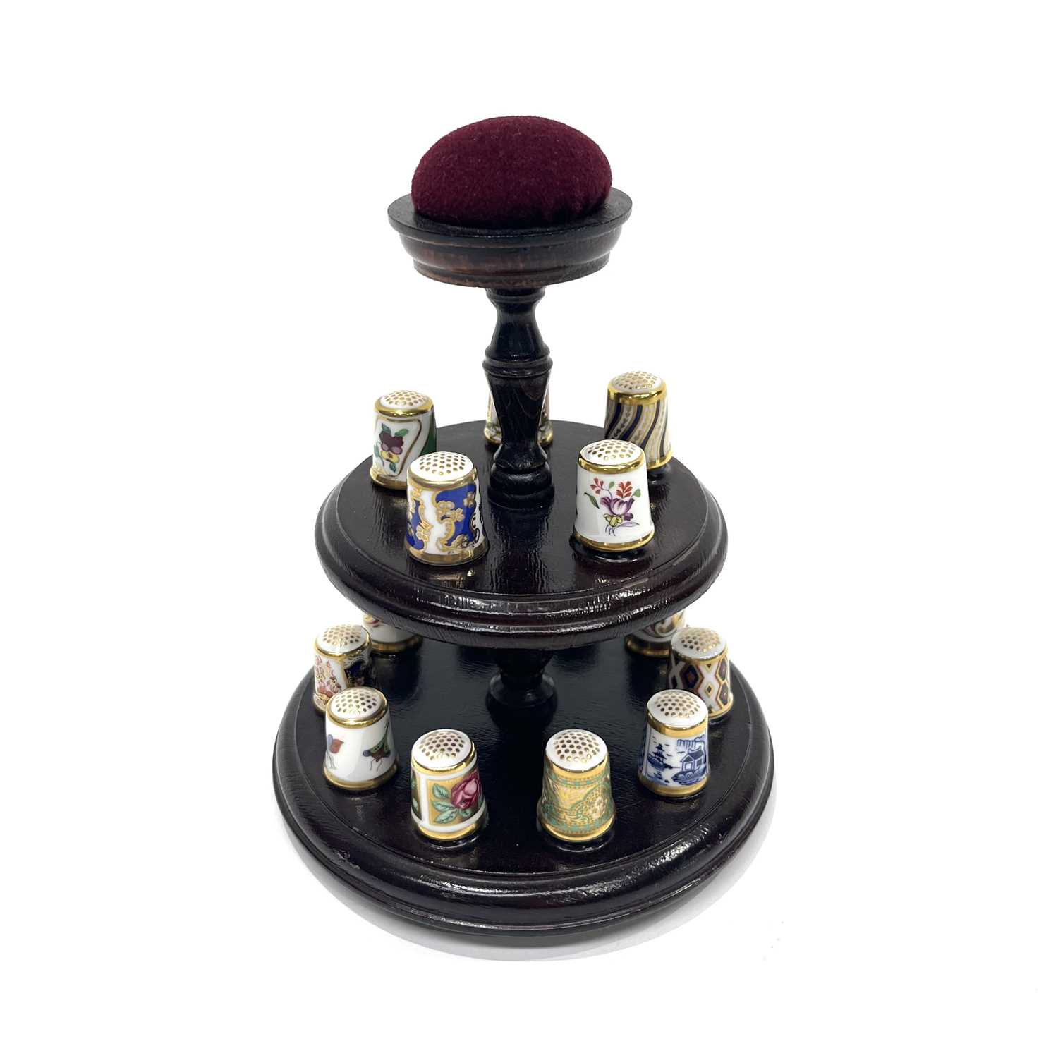 A collection of fifteen Royal Crown Derby thimbles on two tier turned wooden stand with pin - Image 2 of 3