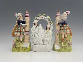 Staffordshire temperance figures collecting water from a fountain, circa 1860, figures modelled as a