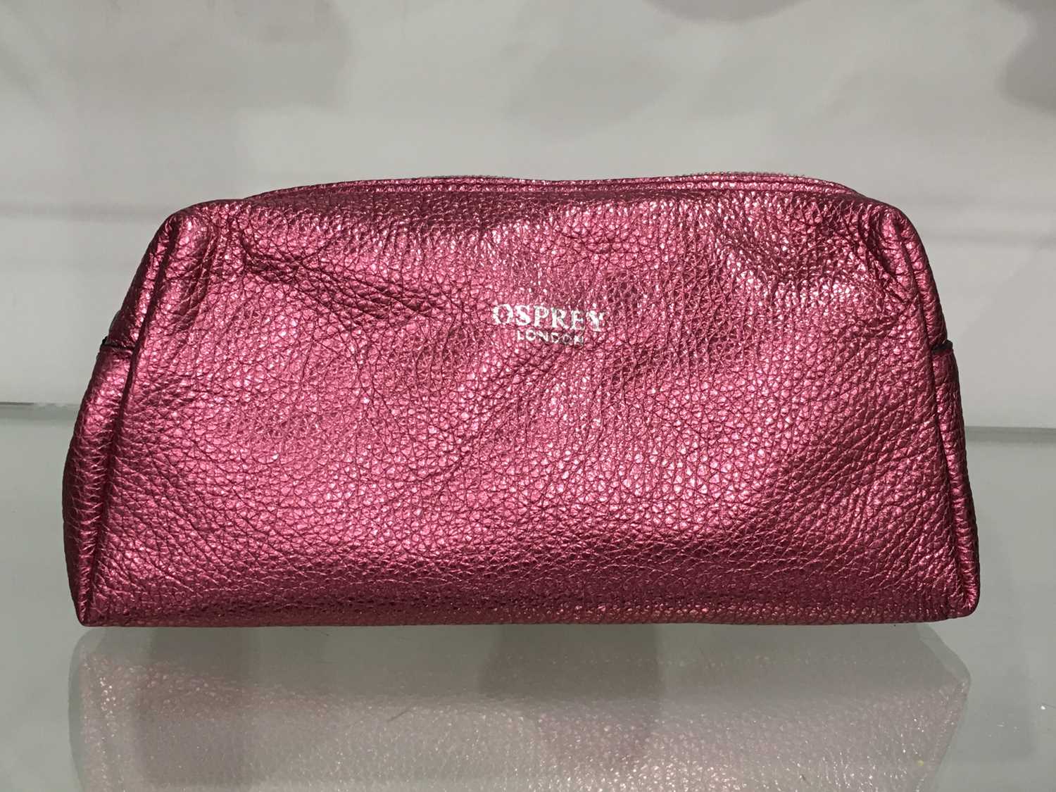 Osprey London, a pink metallic makeup pouch by Graeme Ellisdon, with top zip fastening, measuring
