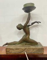 An Art Deco style figural table lamp, modelled in the form of a lady in repose, atop a marble type