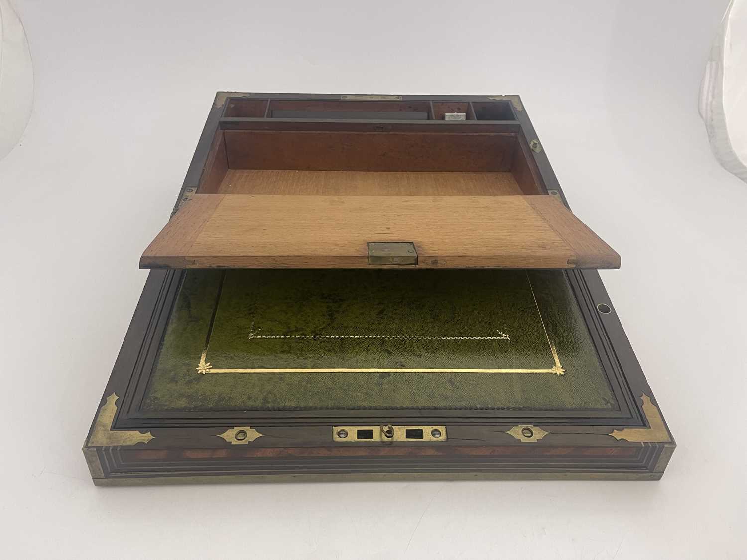 A George III flame mahogany campaign writing slope, circa 1820, brass-bound with a triple strung - Image 7 of 8