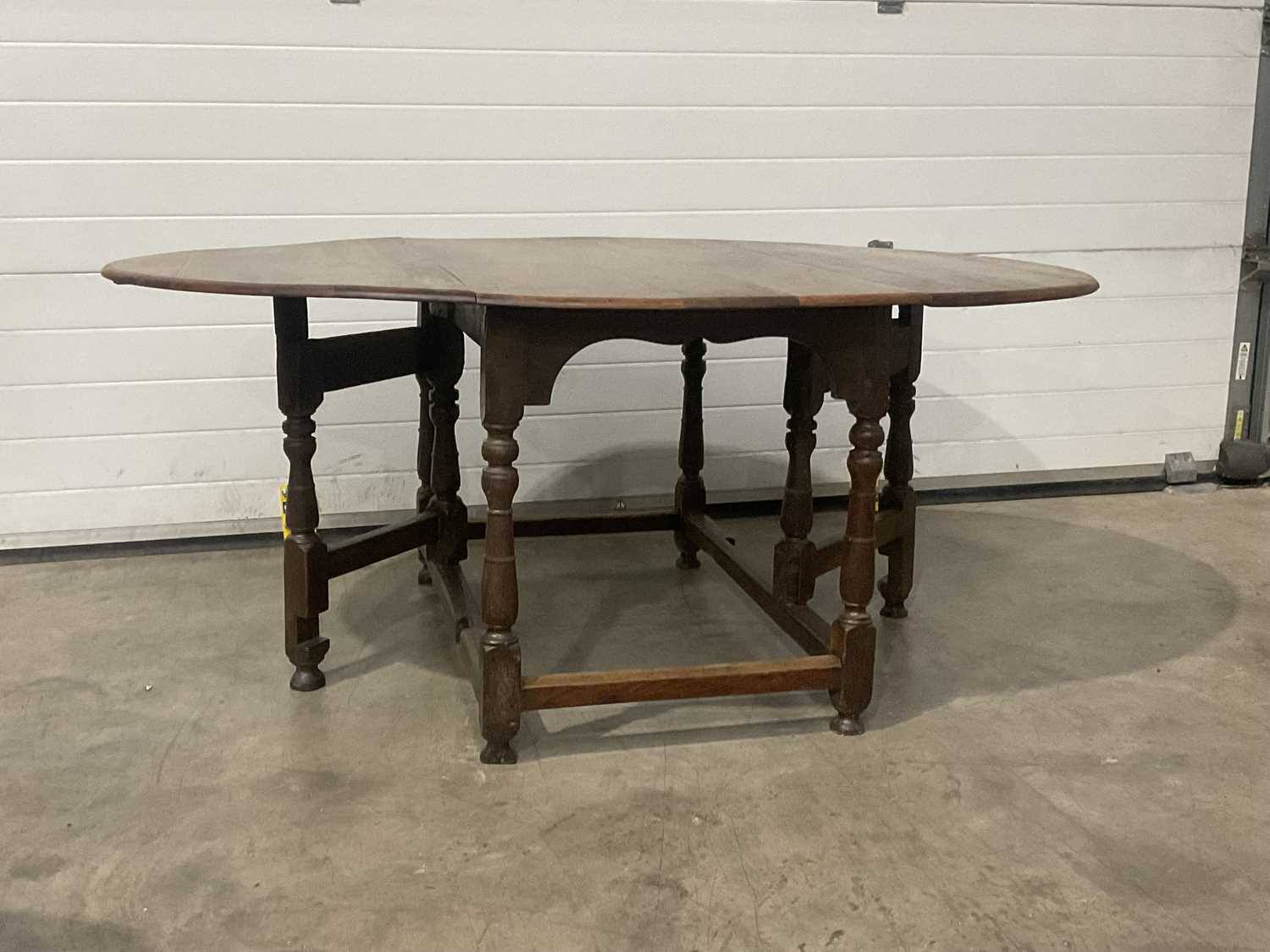 A traditional oak gate leg table, on turned and block supports. W: 174 cm D: 125 cm H: 75 cm - Image 2 of 2