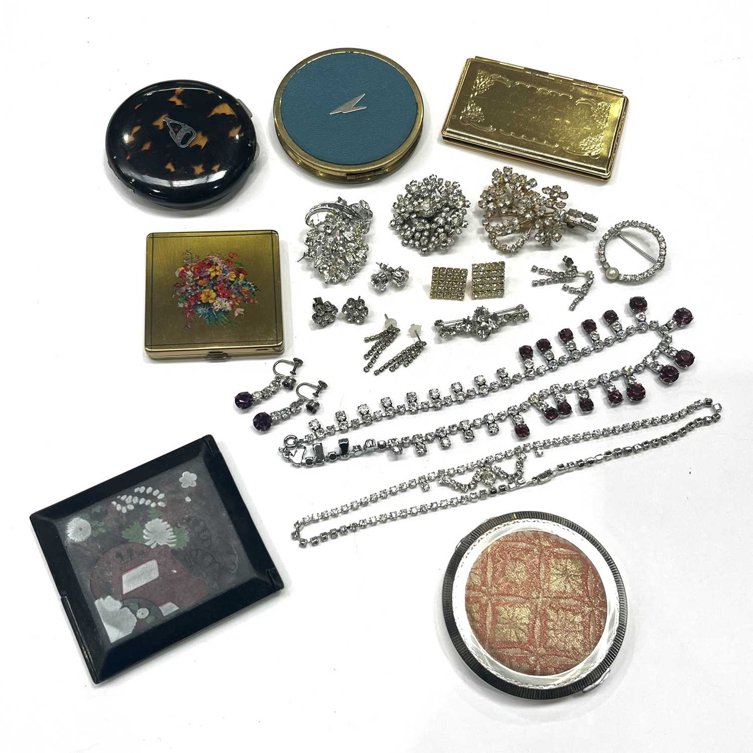 A Vogue compact, other compacts, and a quantity of paste set costume jewellery, (parcel)