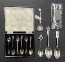 A quantity of silver spoons including hallmarked examples, a cased set with enamel thistle