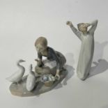 Two Lladro figures, "Boy awakening" NO.4870, and "Food for ducks girl" NO.4849. (2)