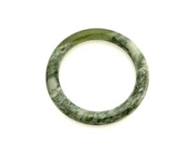 A green hardstone bangle bracelet