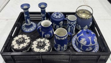A collection jasperware, including a pair of Wedgwood candlesticks decorated with white sprigged