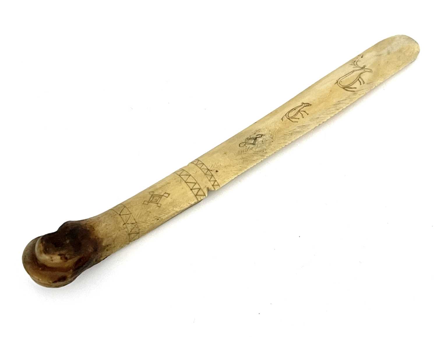 Prisoner of War or Tribal interest, a carved bone page turner or letter opener, probably 19th