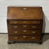 A bureau, fitted three drawers below pull down writing surface, revealing pigeon holes above four