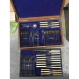 An oak cased part canteen of plated cutlery, including ivorine handled knives, forks, spoons etc