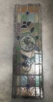 Three leaded stained glass panels with central painted medallions, without frames, 95cm long, af (