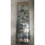 Three leaded stained glass panels with central painted medallions, without frames, 95cm long, af (