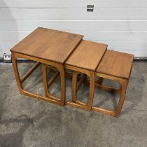 A nest of three G-Plan teak tables, the largest of three measures W: 48 cm D: 47.5 cm H: 50.5 cm