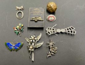 A collection of brooches to include hallmarked silver, micromosaic and a novelty lady's vanity in