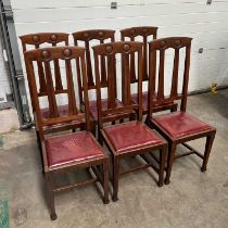 A set of six mahogany Art Nouveau dining chairs, moulded roundels to the bar backs, drop-in