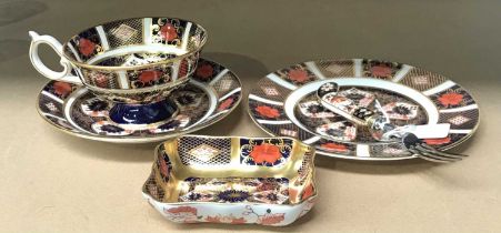 A Royal Crown Derby Imari pattern trio, 1128, an Imari pattern solid gold band pin dish, 1128, and a