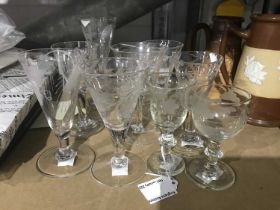 A collection of 19th engraved and etched drinking glasses