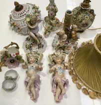 A pair of Conta & Boehme porcelain wall pockets, modelled as putti with grape baskets, together with