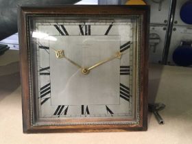 H. Pidduck & Sons, Hanley, an Art Deco square easel desk timepiece, silvered dial with Roman