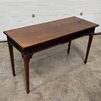A Georgian style mahogany table, on gently tapered square supports W: 150 cm D: 59 cm H: 85 cm