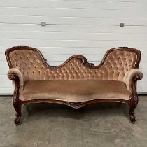 An upholstered twin spoon back settee, on castors W: 200 cm D: 87 cm H: 92 cm