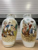 A pair of large porcelain vases painted with scenes of children at play and gilded decoration (2)