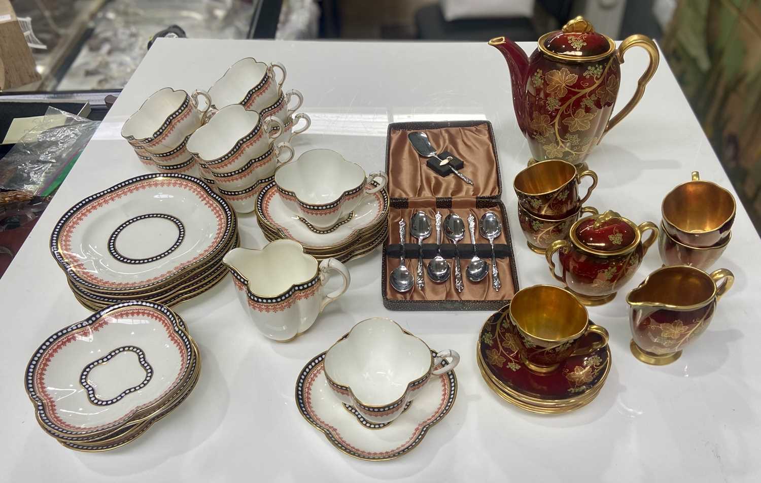 A Coalport tea service together with a Carlton Ware 1950s 'Rouge Royale' Vine pattern coffee service