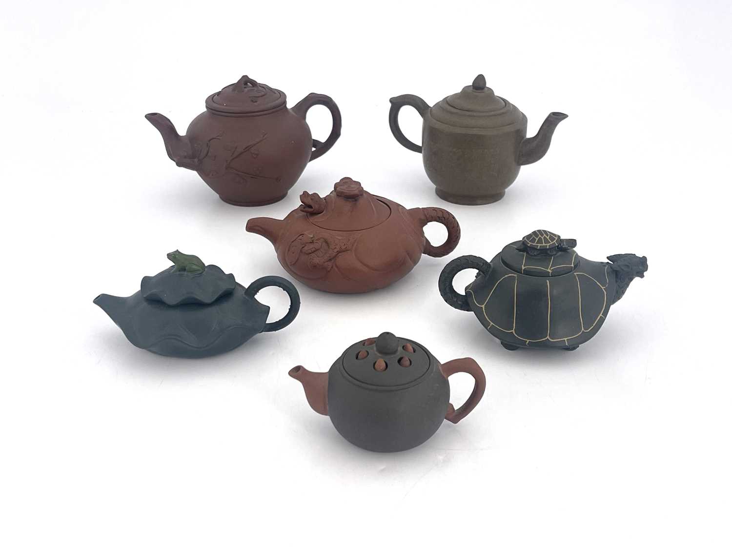 Six Oriental earthenware teapots, relief moulded figural and zoomorphic designs in terracotta and - Image 3 of 5