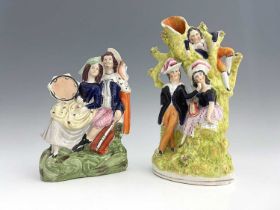 A Staffordshire figure group of musicians/lovers, circa 1850, arboreal scene modelled as a pair of