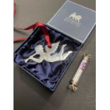 A boxed Elizabeth II silver Christmas decoration retailed by Baybrook & Britten and a hallmarked