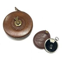 A leather bound tape measure and Zeiss measure (2)