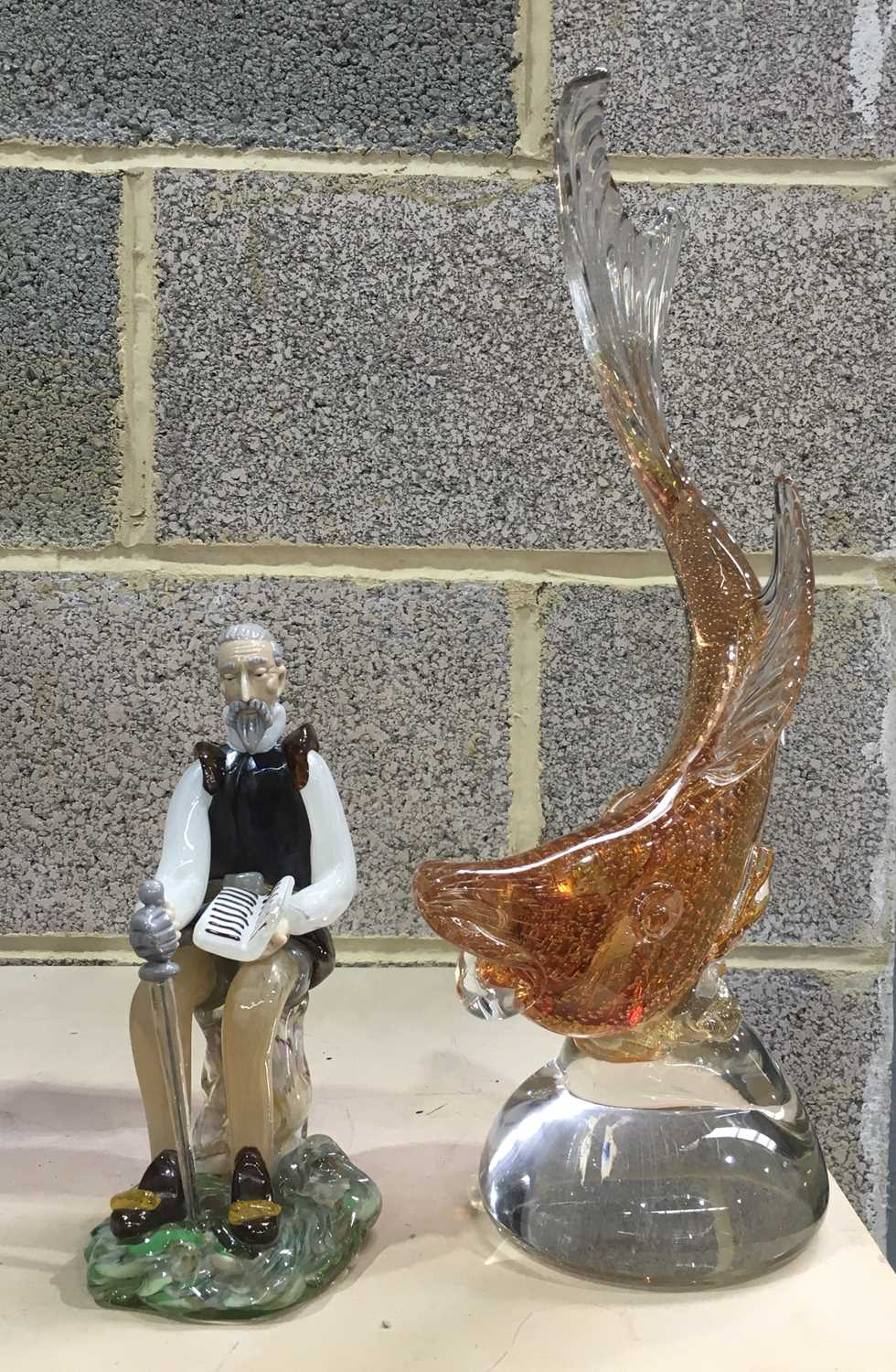 A Murano Art Glass fish, gold body with bubble inclusions, 39cm high, together with a glass figure