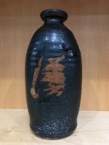 A Tenmoku type studio pottery vase, elongated ovoid form, with abstract motif, 23cm high