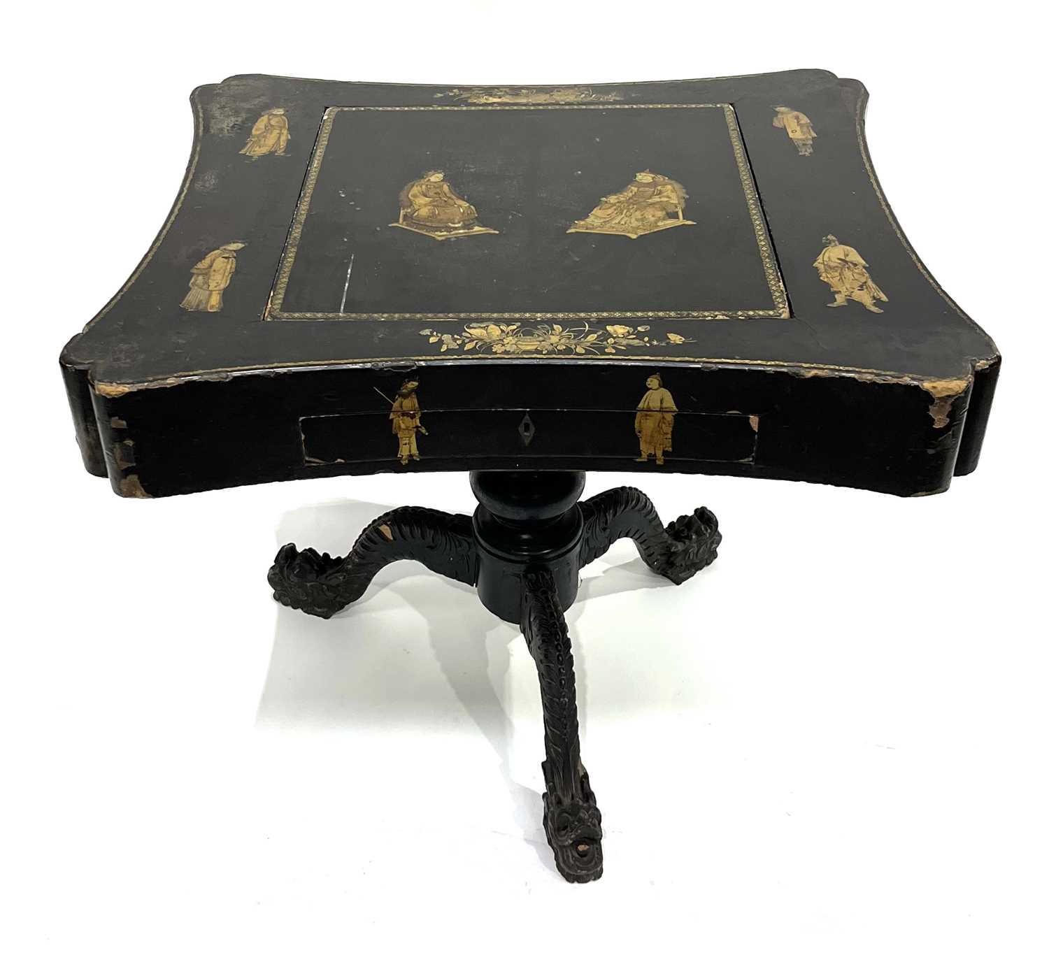 A Chinese black lacquered and gilt games table, Qing Dynasty, inverted top decorated with gilt