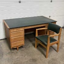 A 1950s oak Carson style desk and chair W: 153 cm D: 84 cm H: 74.5 cm (2)