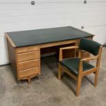 A 1950s oak Carson style desk and chair W: 153 cm D: 84 cm H: 74.5 cm (2)