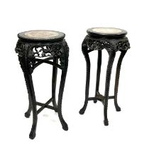 Two Chinese carved hardwood high jardiniere stands, late Qing Dynasty, circa 1900, each with inset