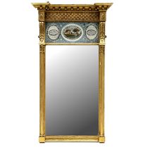 A Regency giltwood pier glass, circa 1820, projecting cornice, basket lattice and verre eglomise